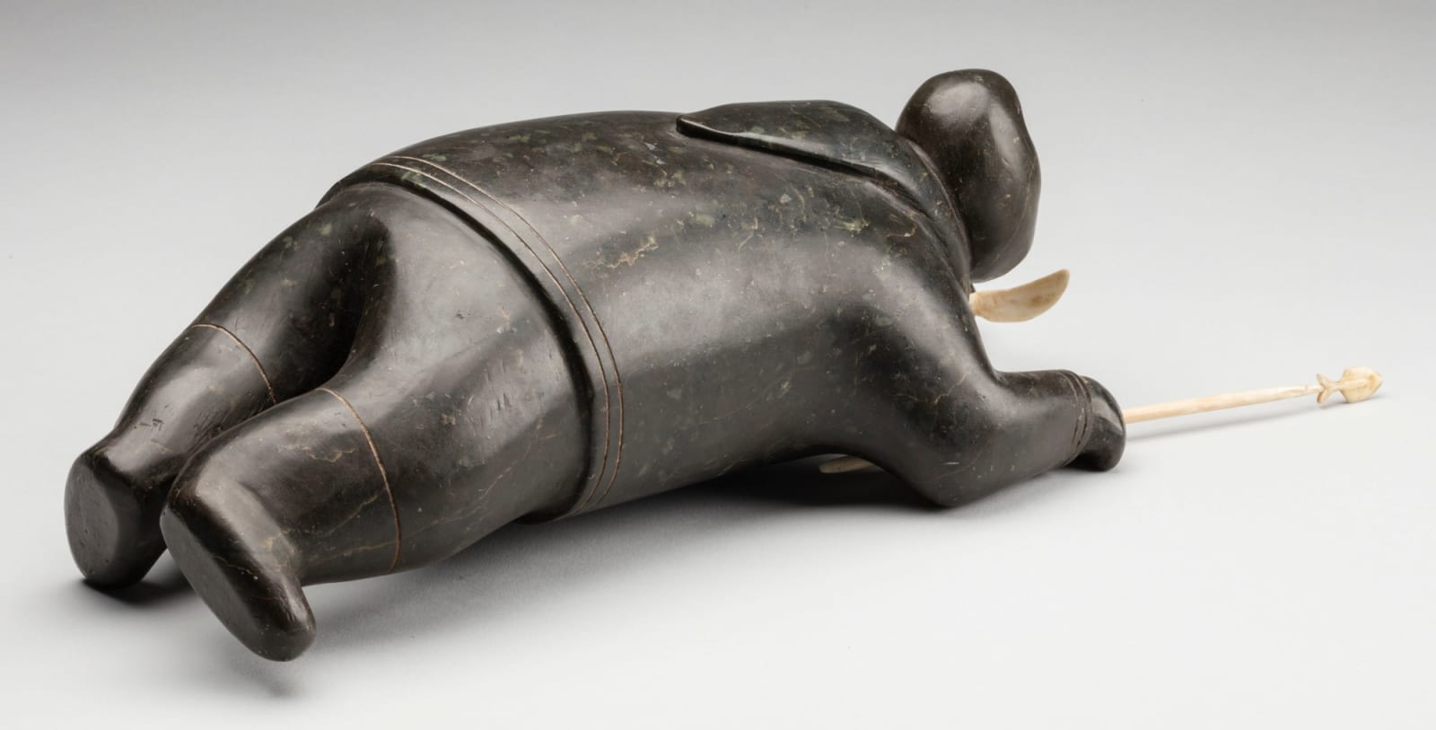 Attributed to JOHNNY INUKPUK, R.C.A (1911-2007) INUKJUAK (PORT HARRISON), Crawling Hunter with Knife and Spear, c. 1952