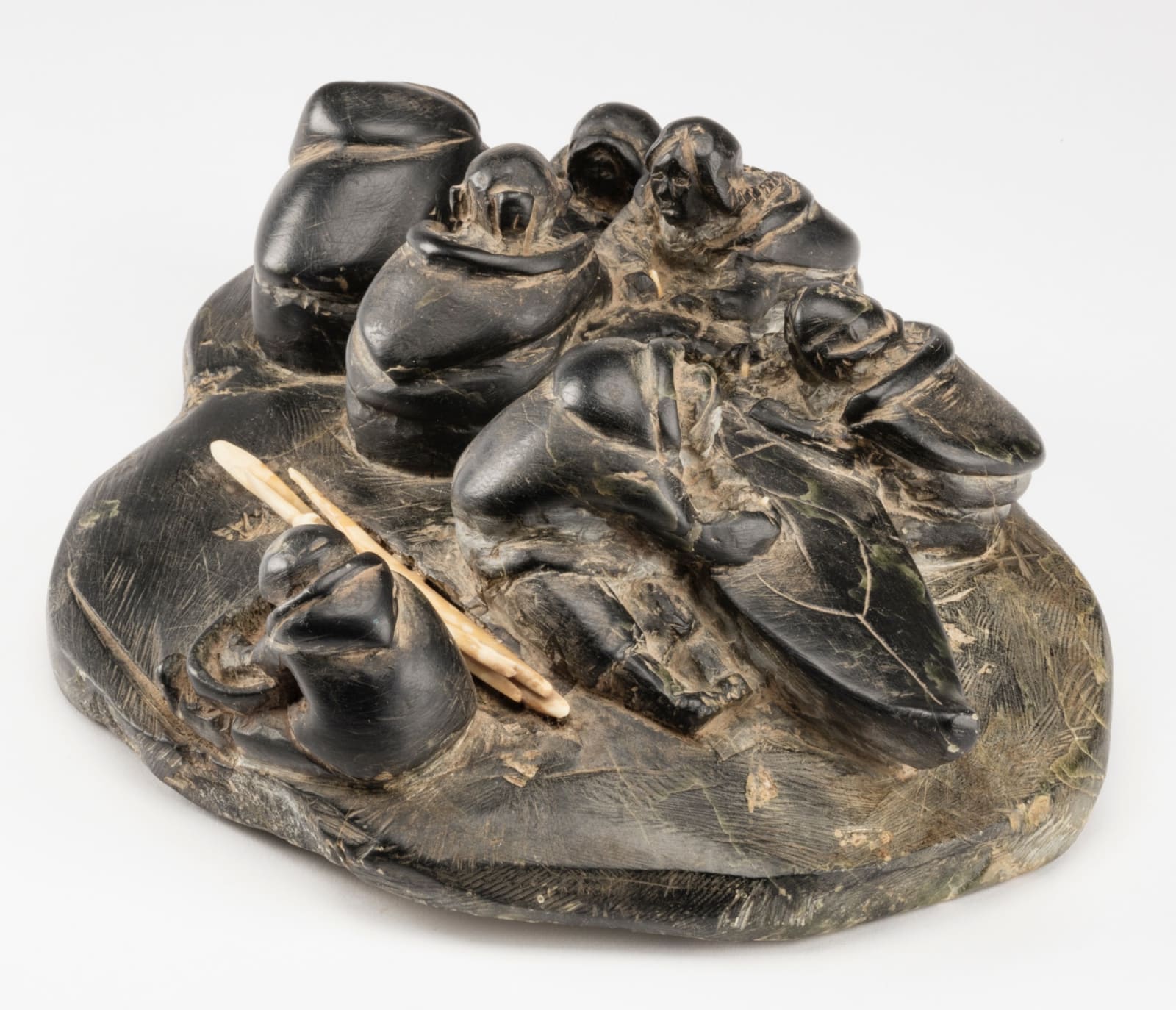 ENNUTSIAK (1893-1967) IQALUIT (FROBISHER BAY), Women Making a Kayak, c. 1958-60