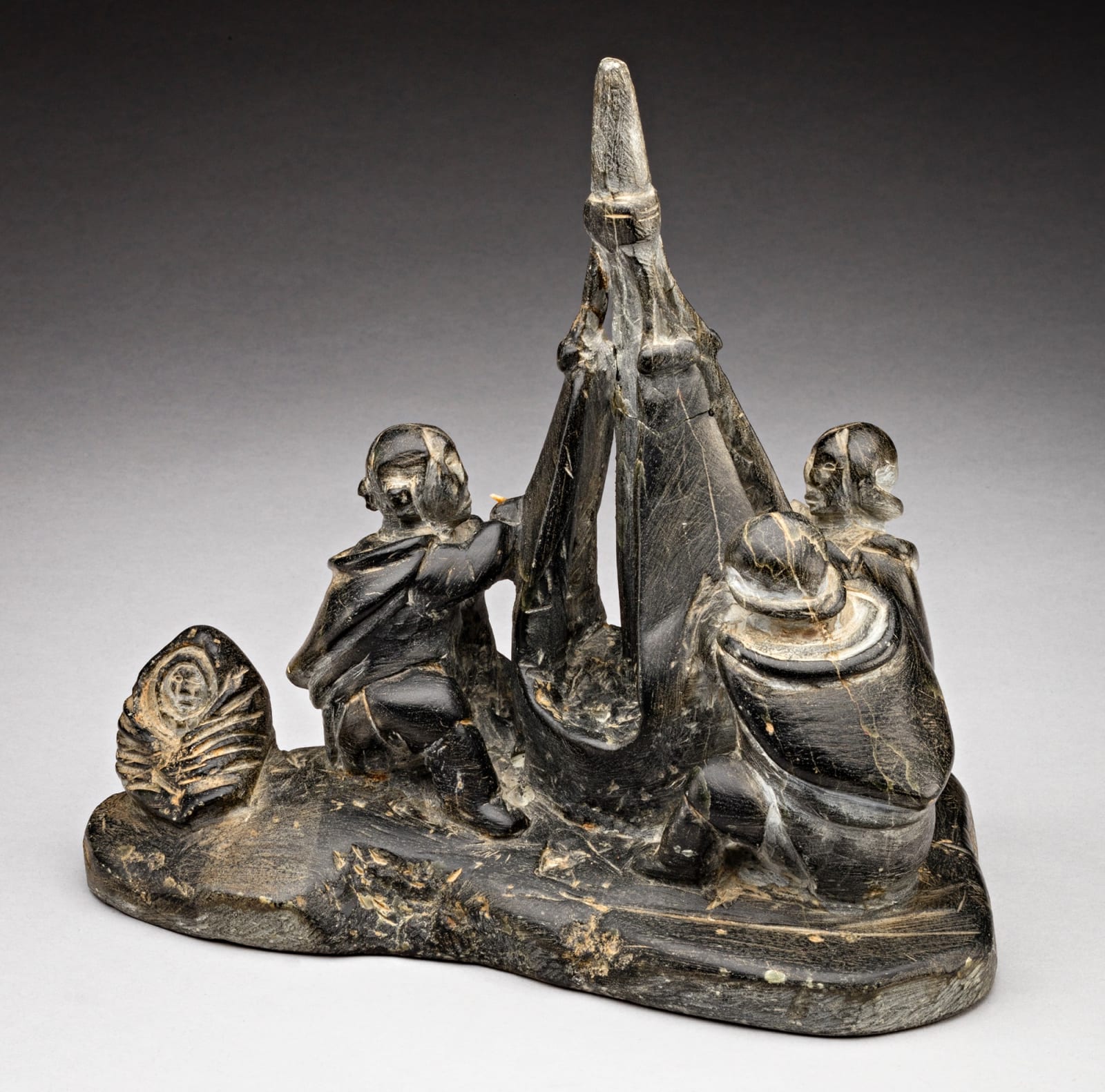 ENNUTSIAK (1893-1967) IQALUIT (FROBISHER BAY), Women Sewing Skins for a Kayak, c. 1958-60