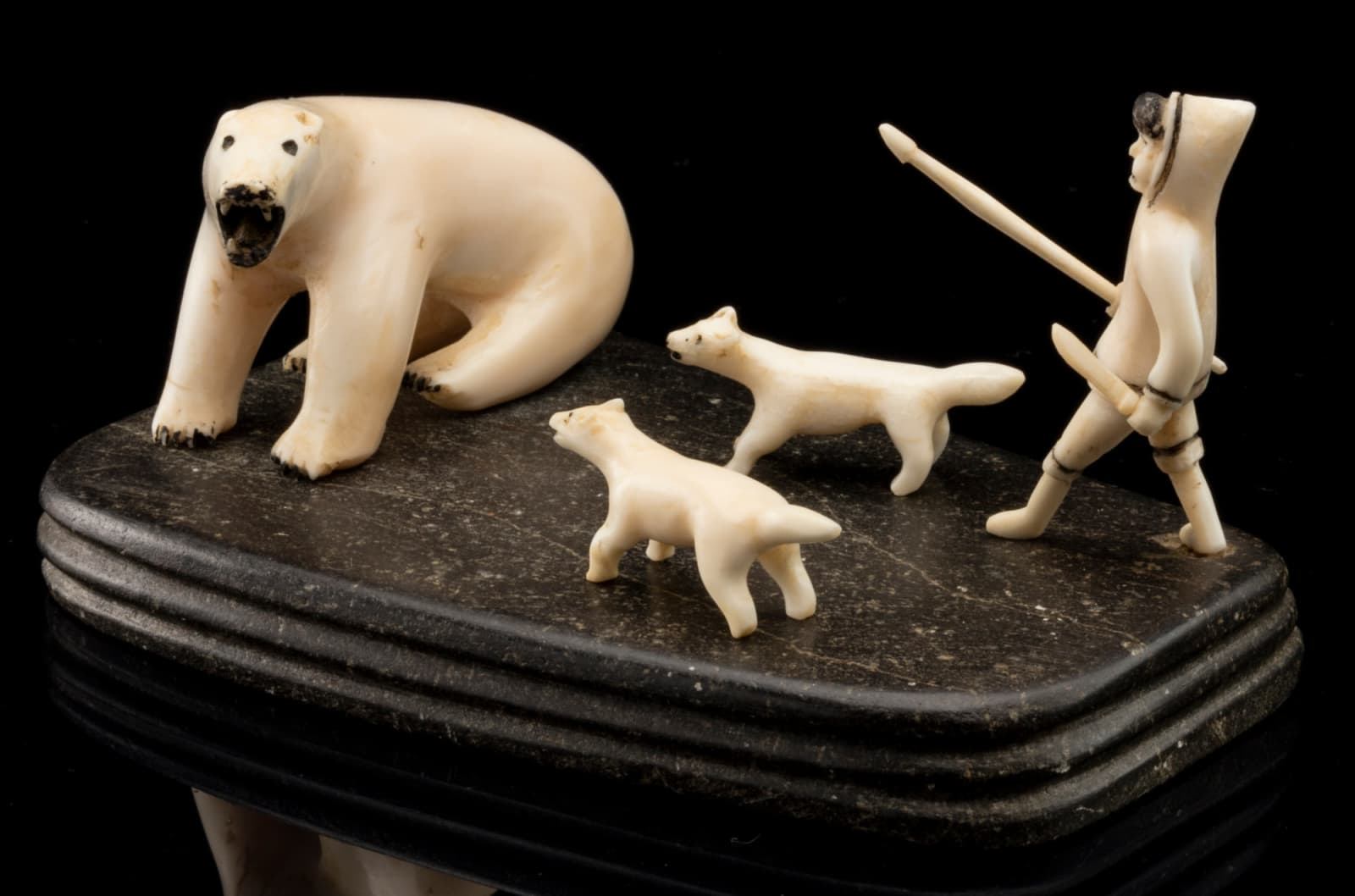 UNIDENTIFIED ARTIST, EASTERN CANADIAN ARCTIC, Hunter and Dogs Approaching a Polar Bear, early 1940s or 1950s