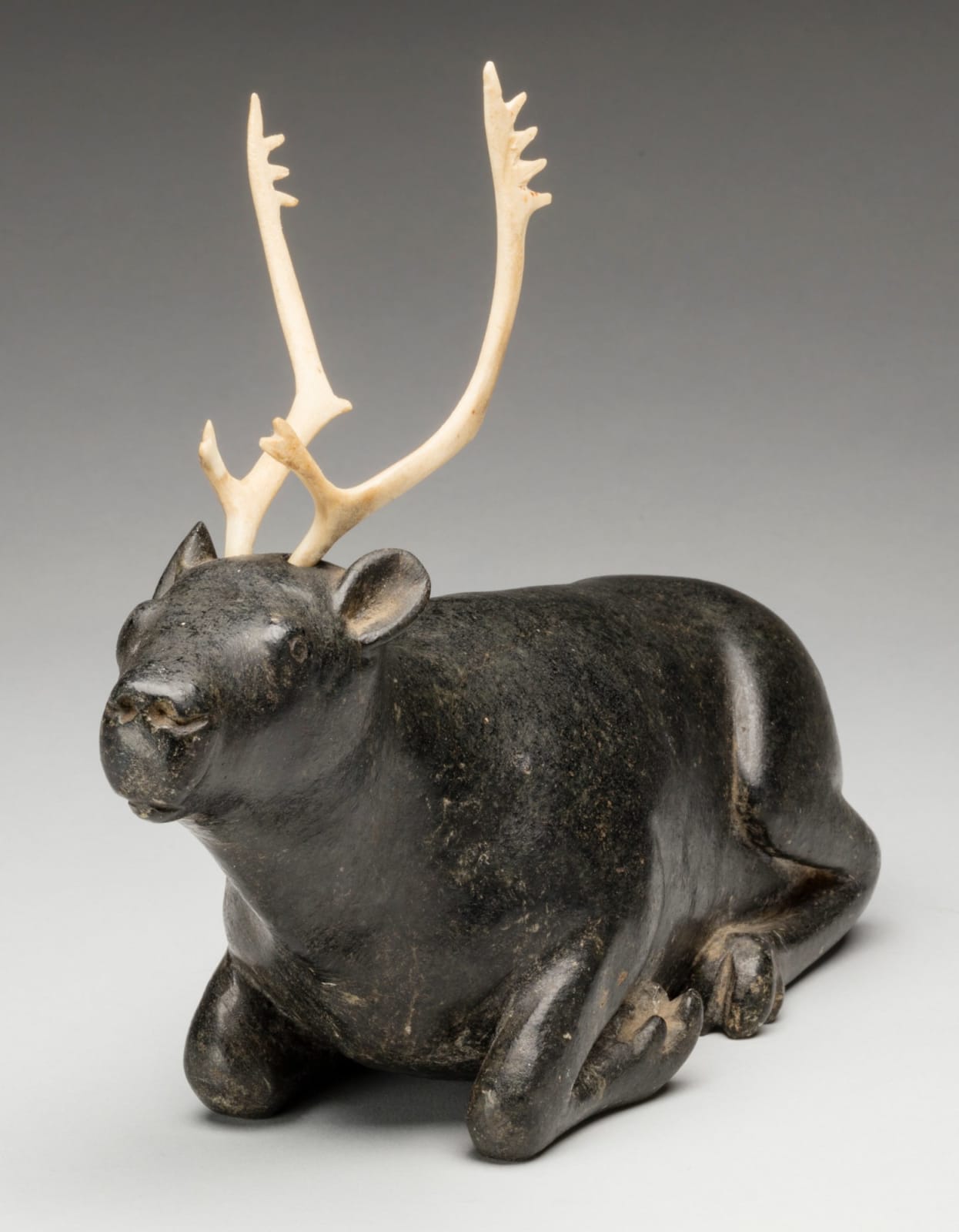 UNIDENTIFIED INUIT ARTIST, EASTERN CANADIAN ARCTIC, Resting Caribou, c. 1960s or 1970s