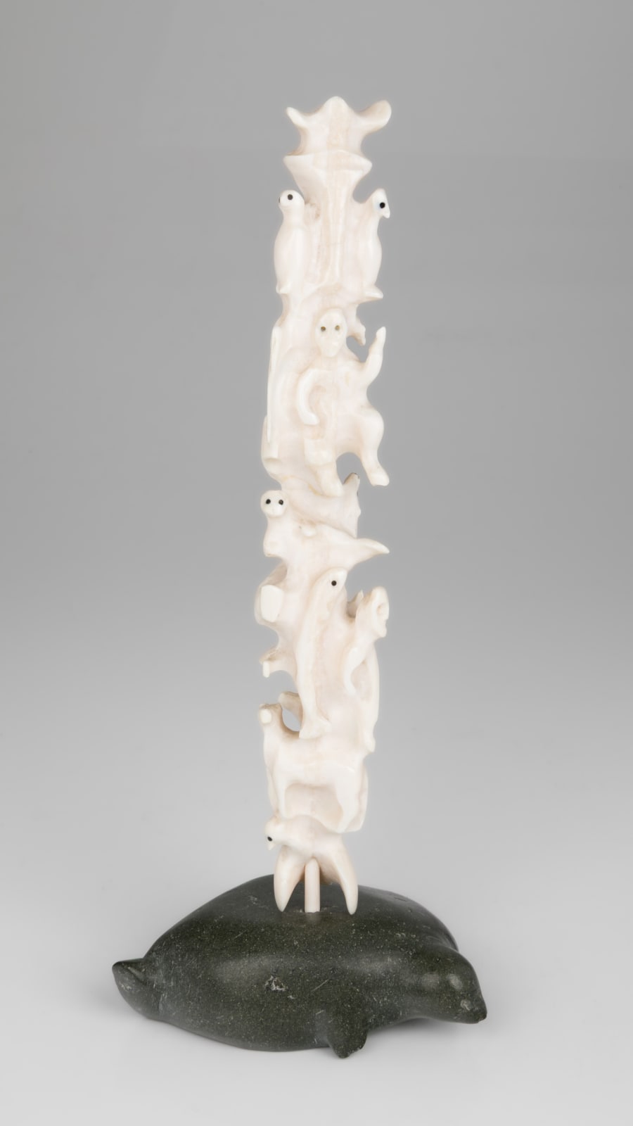 BERNADETTE IVALOOARJUK SAUMIK (1938-) NAUJAAT (REPULSE BAY) / RANKIN INLET (KANGIQLINIQ), Totemic Composition with Inuit and Owls on Seal Base, 1977