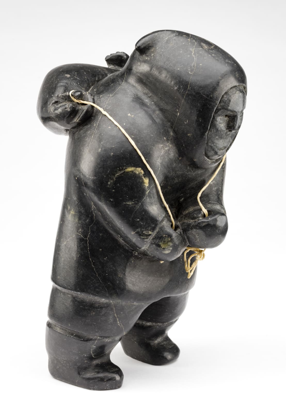 AKEEAKTASHUK (1898-1954) INUKJUAK (PORT HARRISON), Hunter Carrying a Captured Seal, c. 1951-53