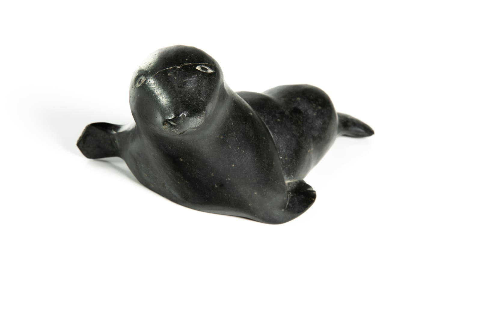 DAVID ARNASUNGAAQ (1964-) QAMANI'TUAQ (BAKER LAKE), Lounging Seal, c. 1990