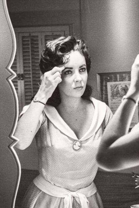 Sid Avery, Elizabeth Taylor on the set of 'Giant, 1956