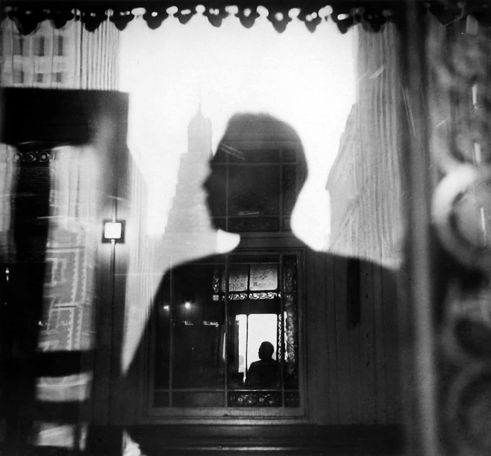 Louis Faurer, Self-portrait,42nd Street and 3rd Avenue El Station Looking Toward Tudor City, New York,, 1946.