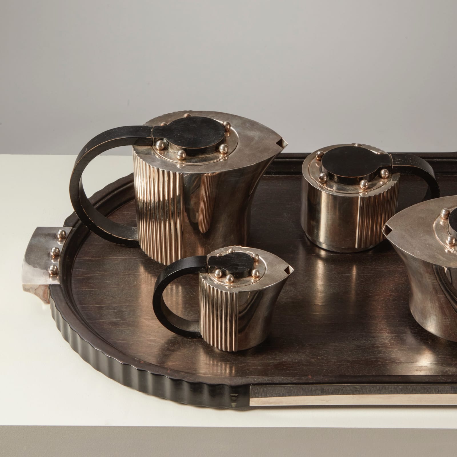 JEAN PUIFORCAT, FOUR-PIECE 'ETCHÉA' TEA SERVICE ON THE TRAY, c. 1937