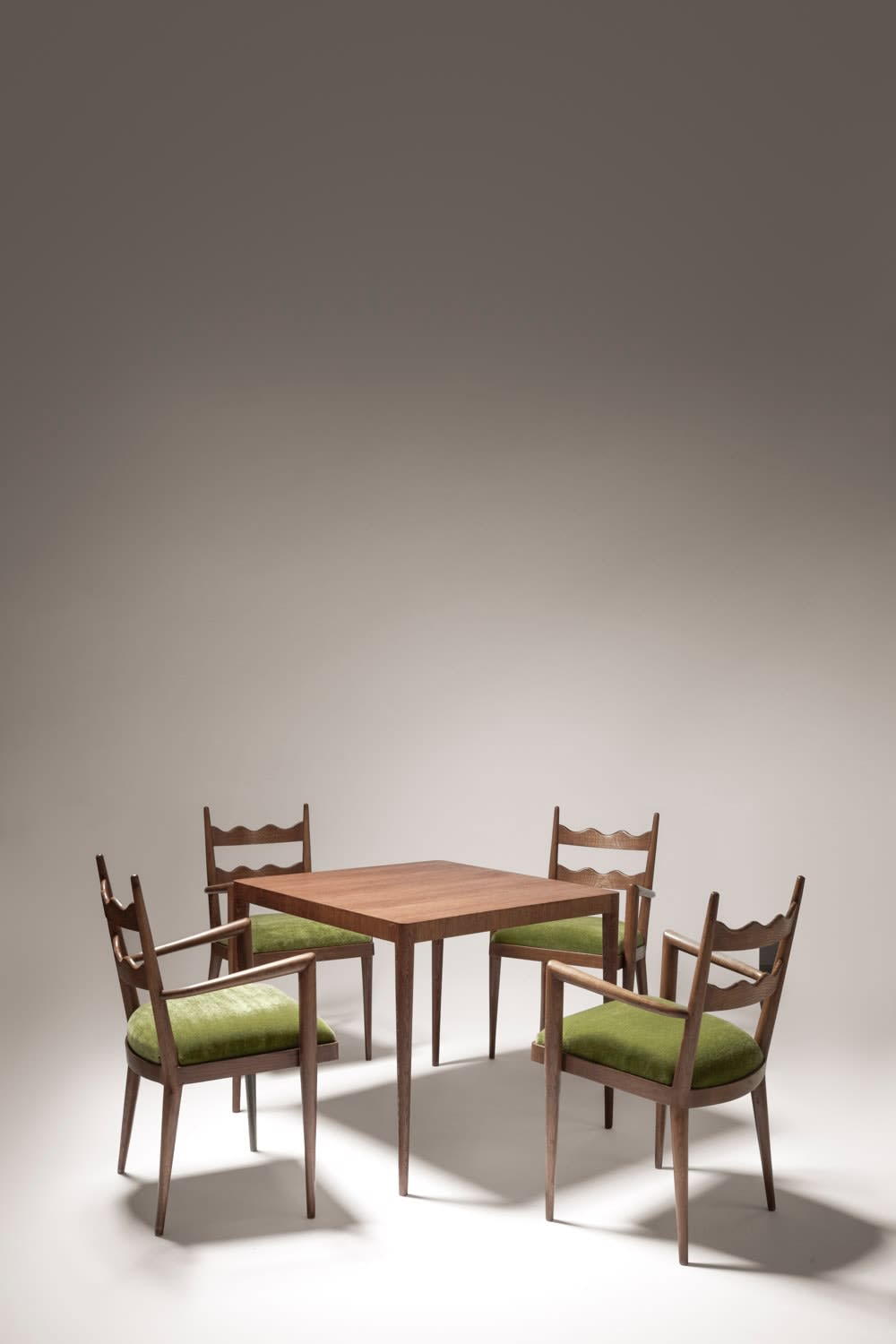 JEAN ROYÈRE, GAME TABLE AND SET OF FOUR CHAIRS, c. 1950