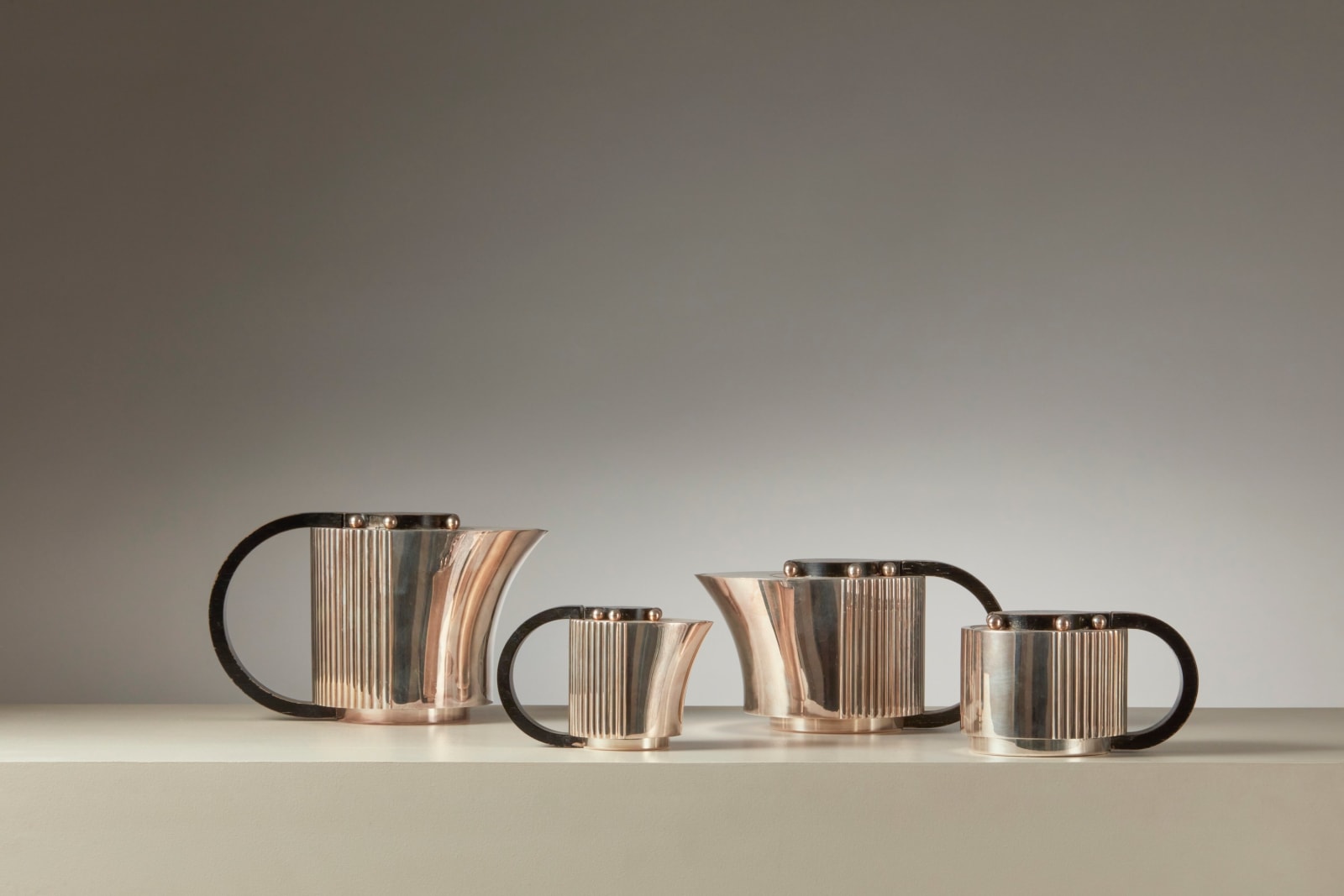 JEAN PUIFORCAT, FOUR-PIECE 'ETCHÉA' TEA SERVICE ON THE TRAY, c. 1937