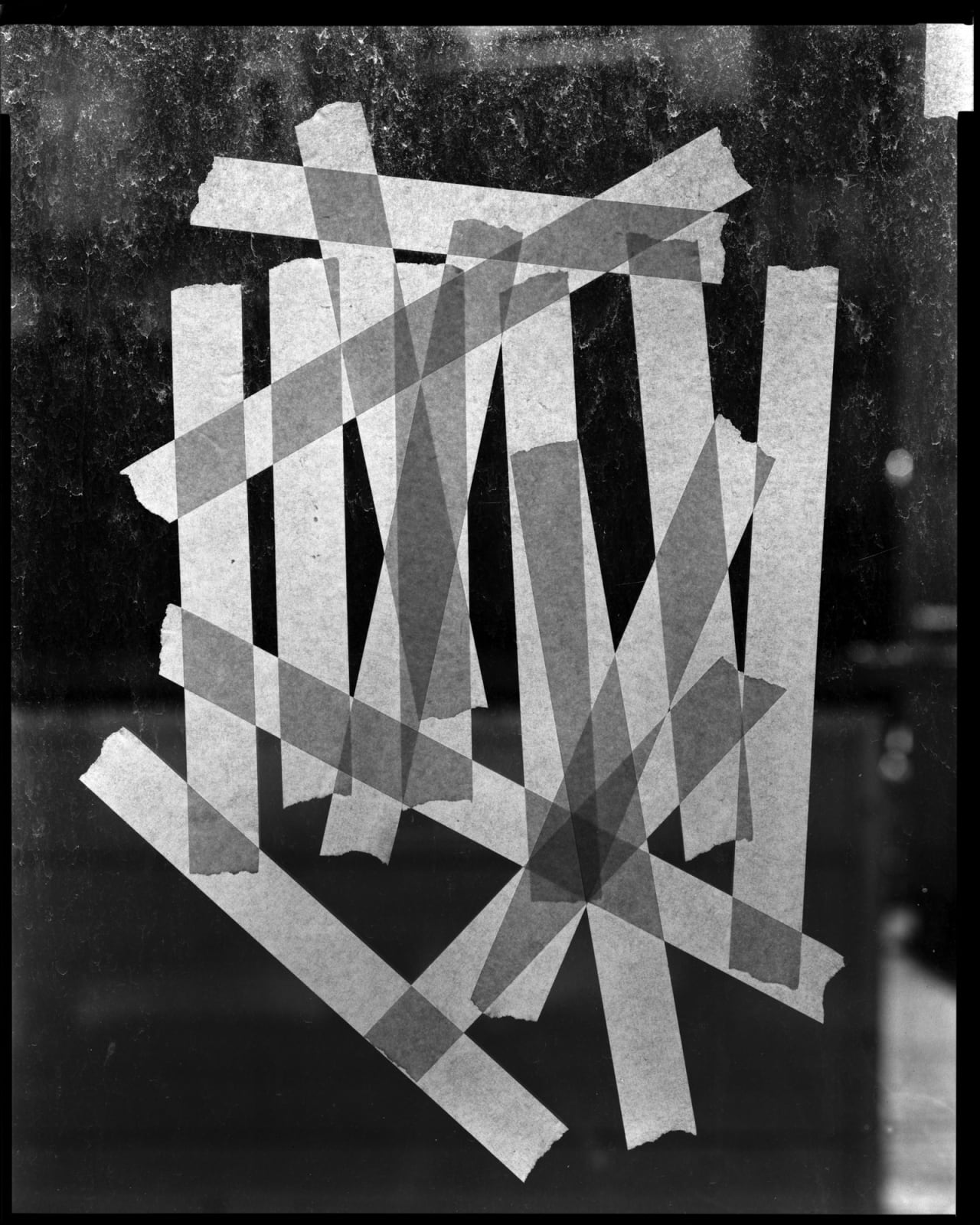 Thomas Manneke, tape on window