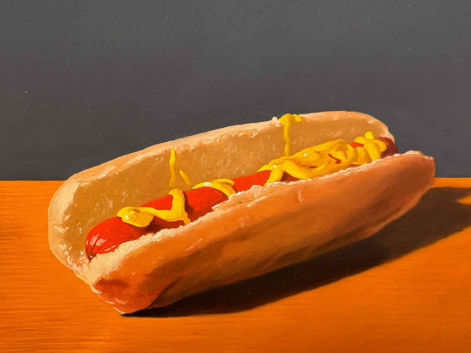 Painting of a toy dog with a hot dog
