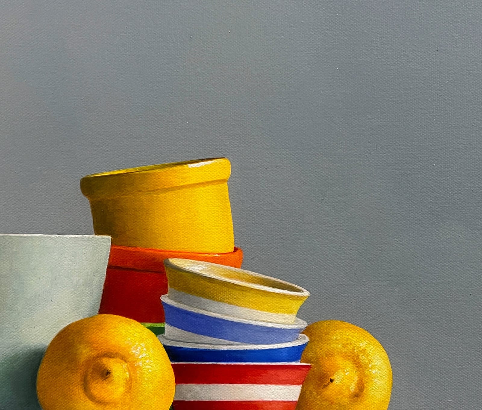 Detail of Lemons with light green bowl, stack of striped bowls, and small bowls