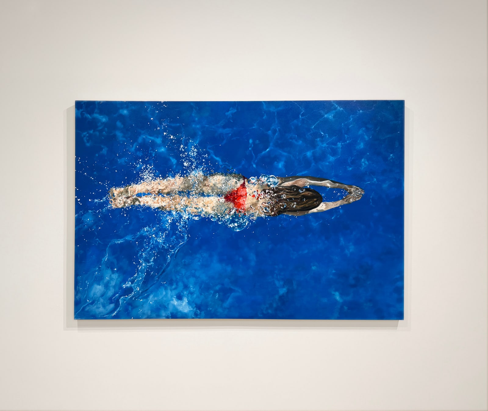 Painting of a woman swimming