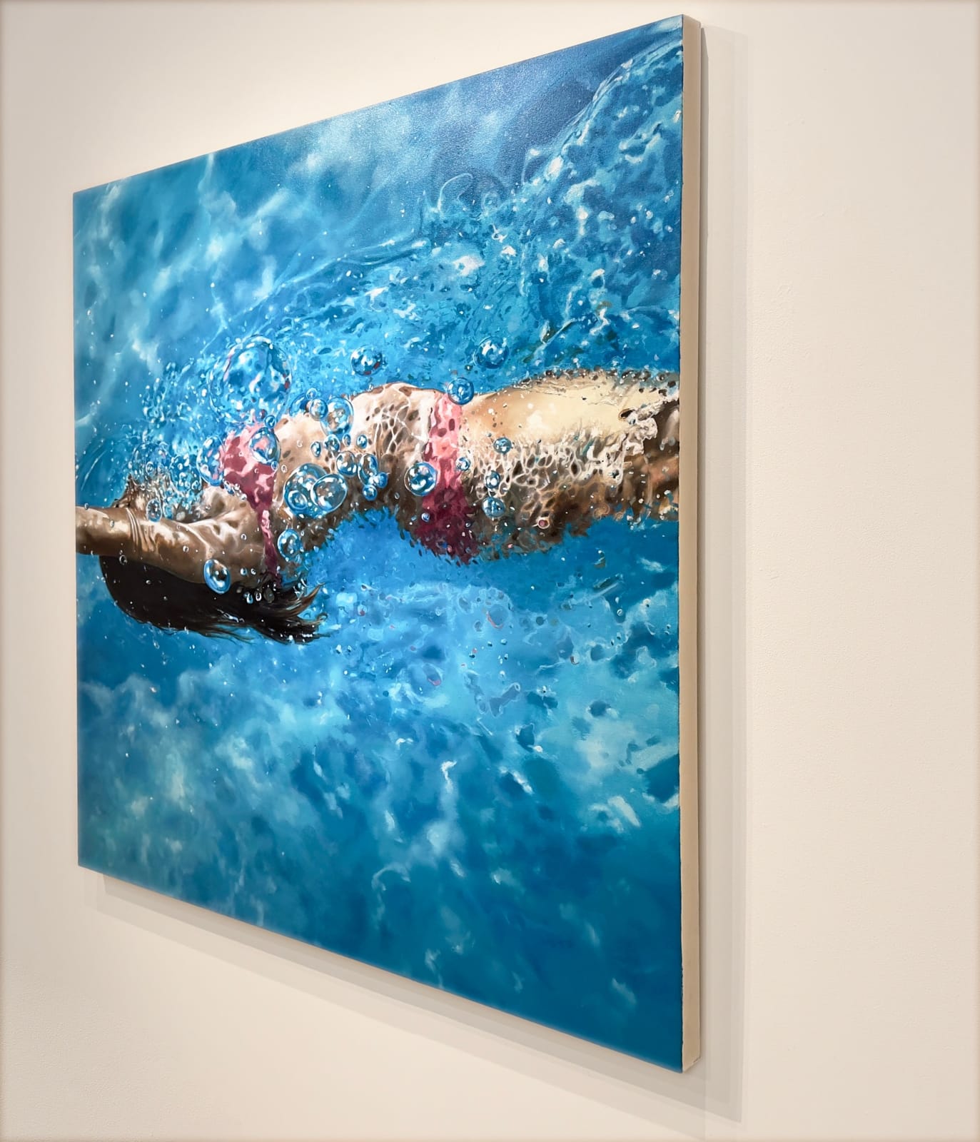 Painting of a woman on her back swimming