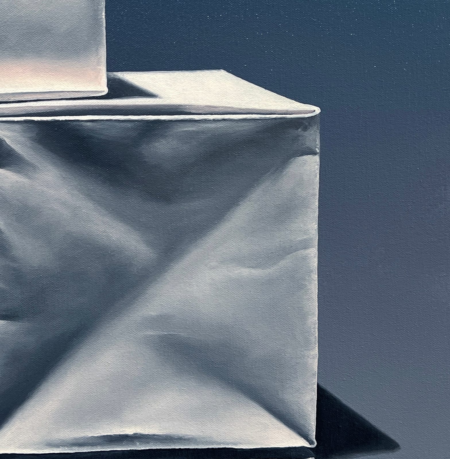 Right side detail of Pyramid of origami paper boxes before dark blue background