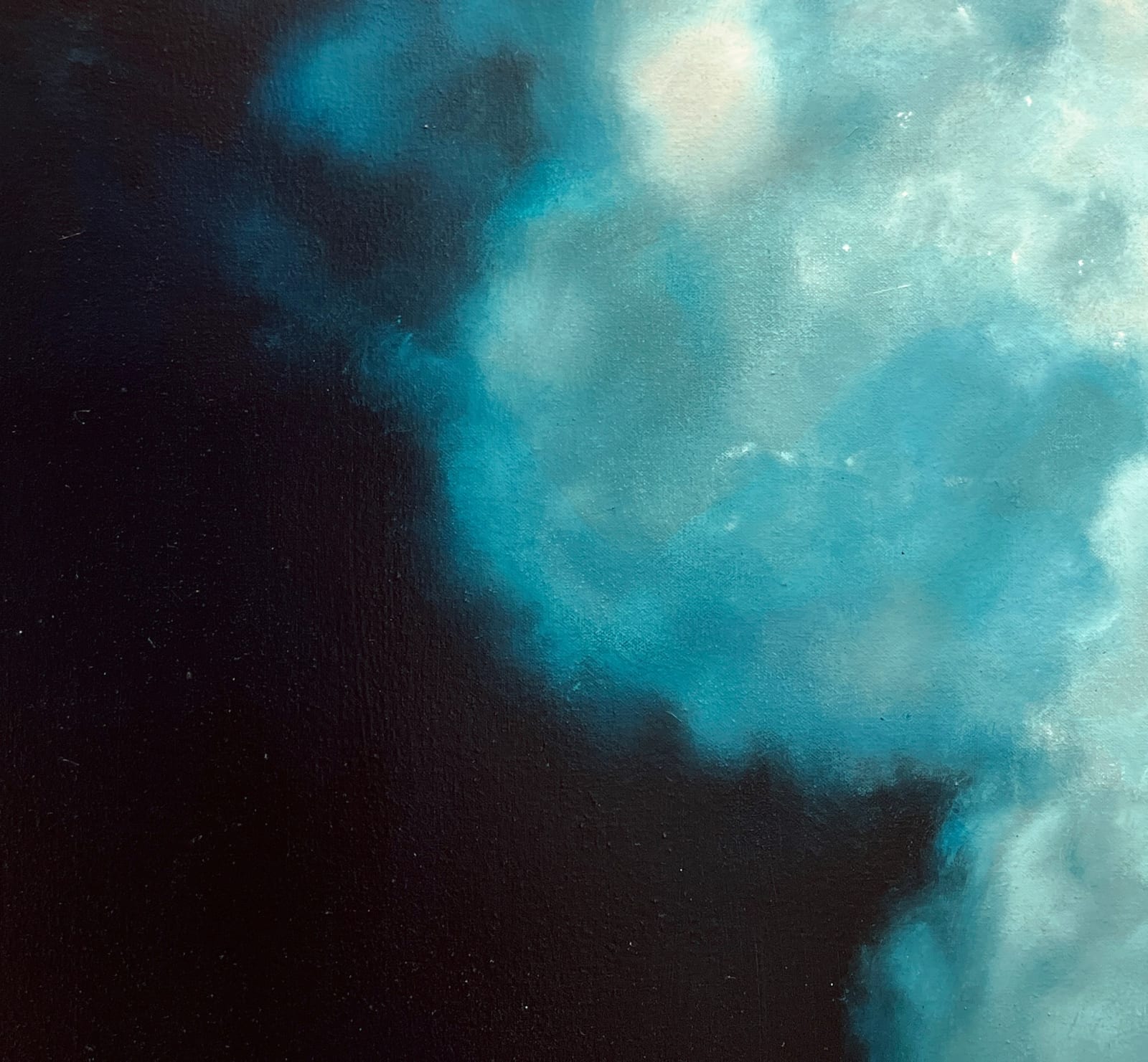 Large plume of bubbles before dark background on canvas