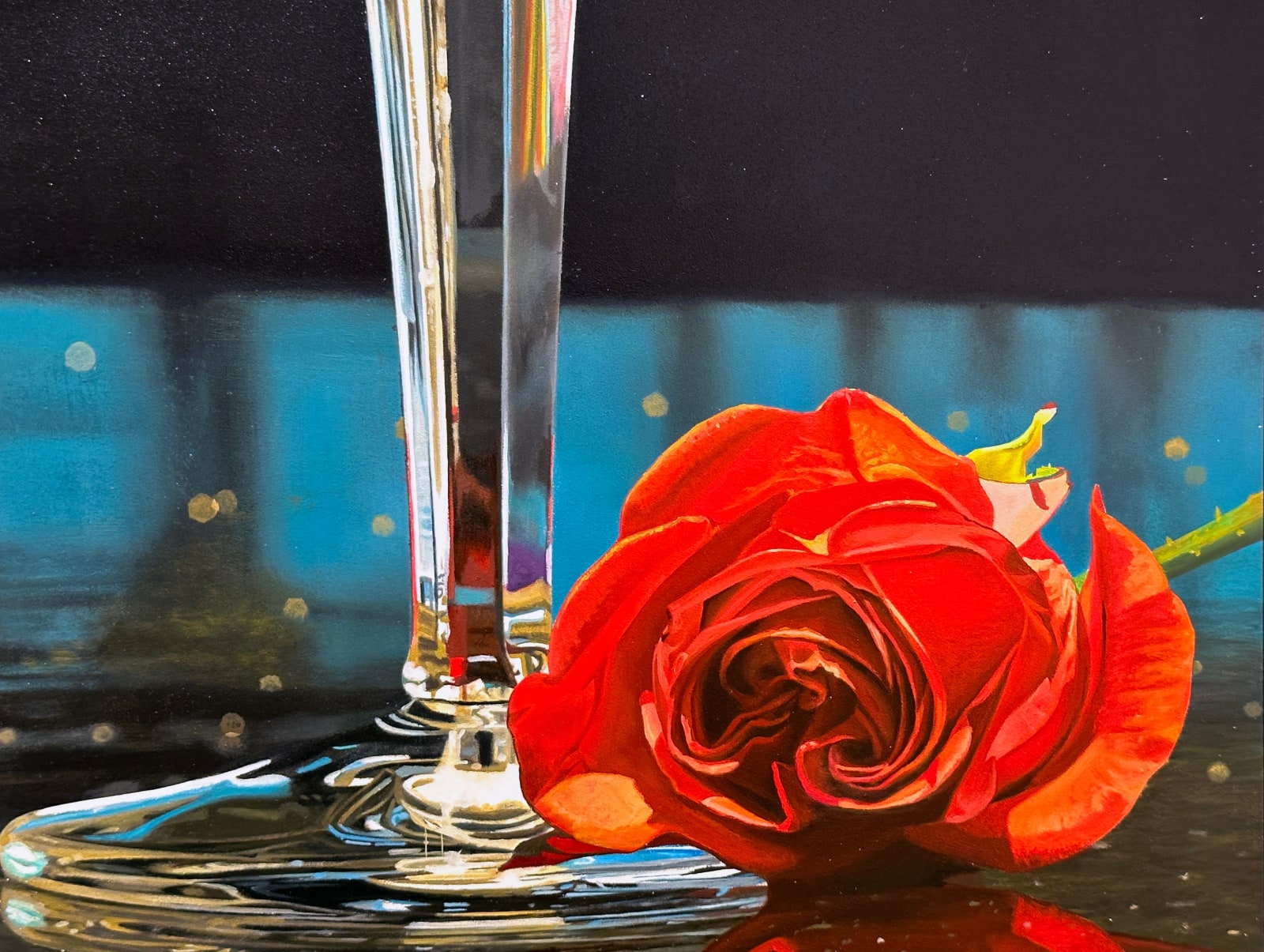 Two Crystal Champagne Glasses fill with bubbly and accompanied by a rose.