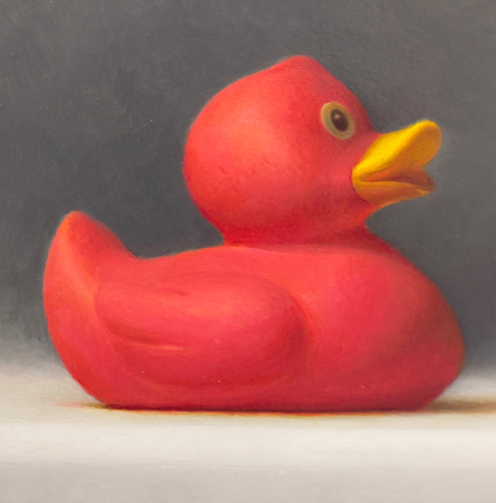 Painting of a rubber duck and a dragon fruit with a paper beak