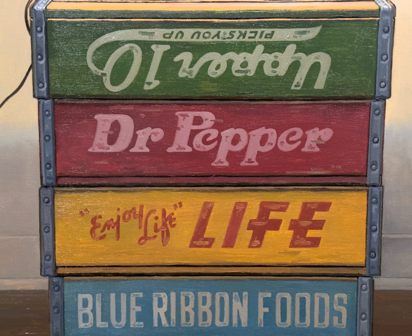 Painting of an Elvis figurine on top of a box with a desk lamp