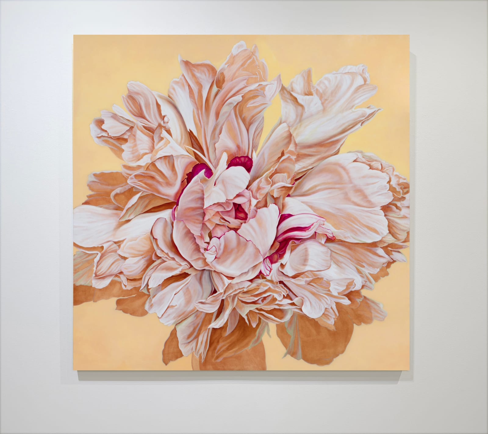 Large painting of beige peony on yellow background