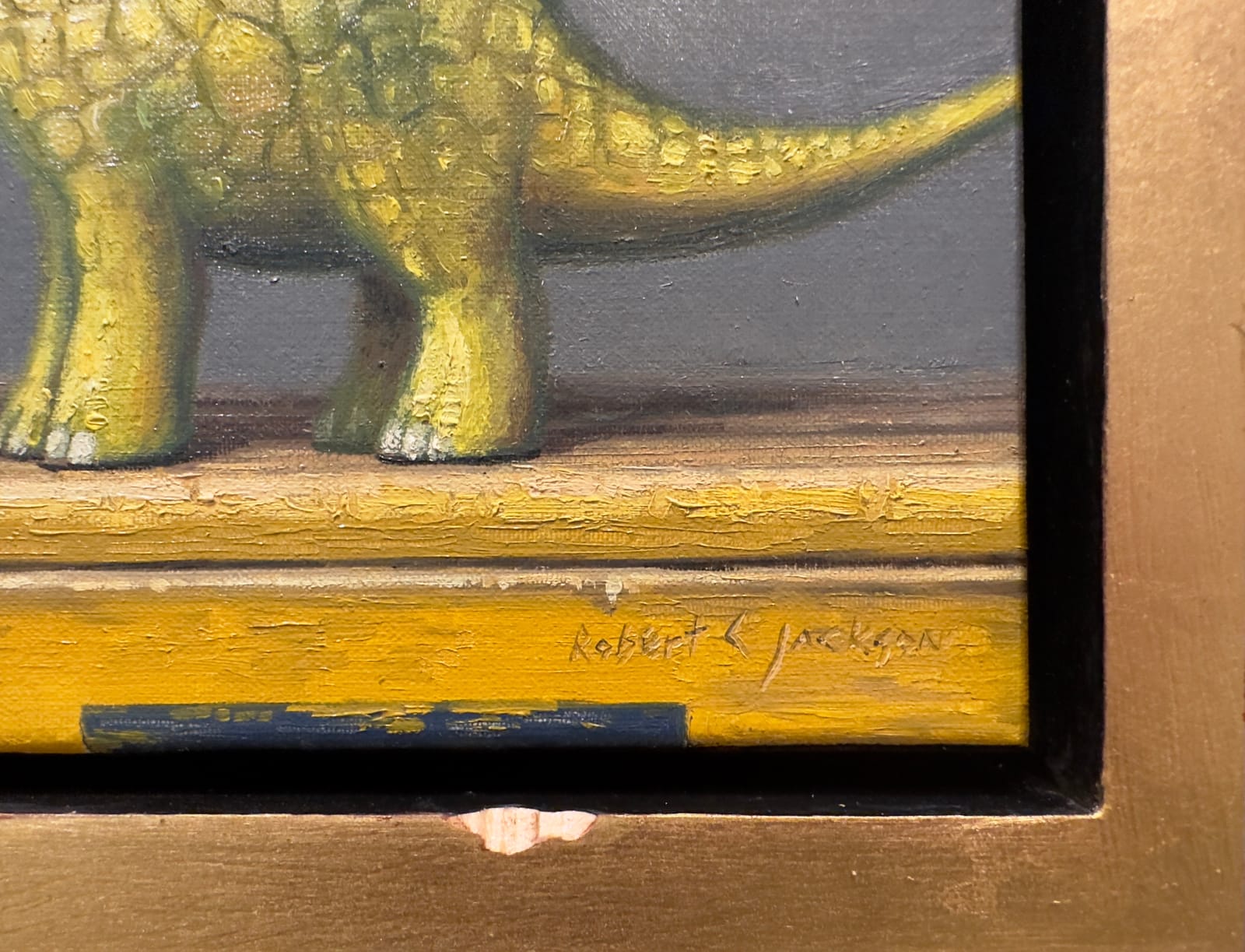 Painting of a dinosaur with a bit apple beside it, all surrounded by a bitten frame