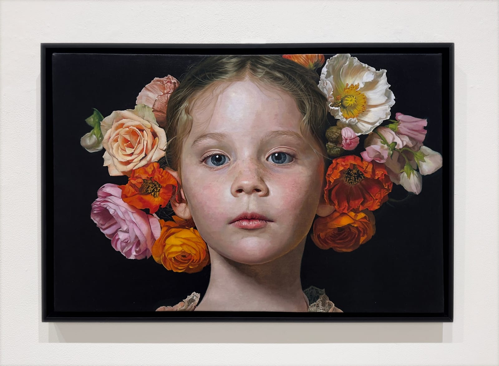 Portrait of a young girl with flowers in her hair