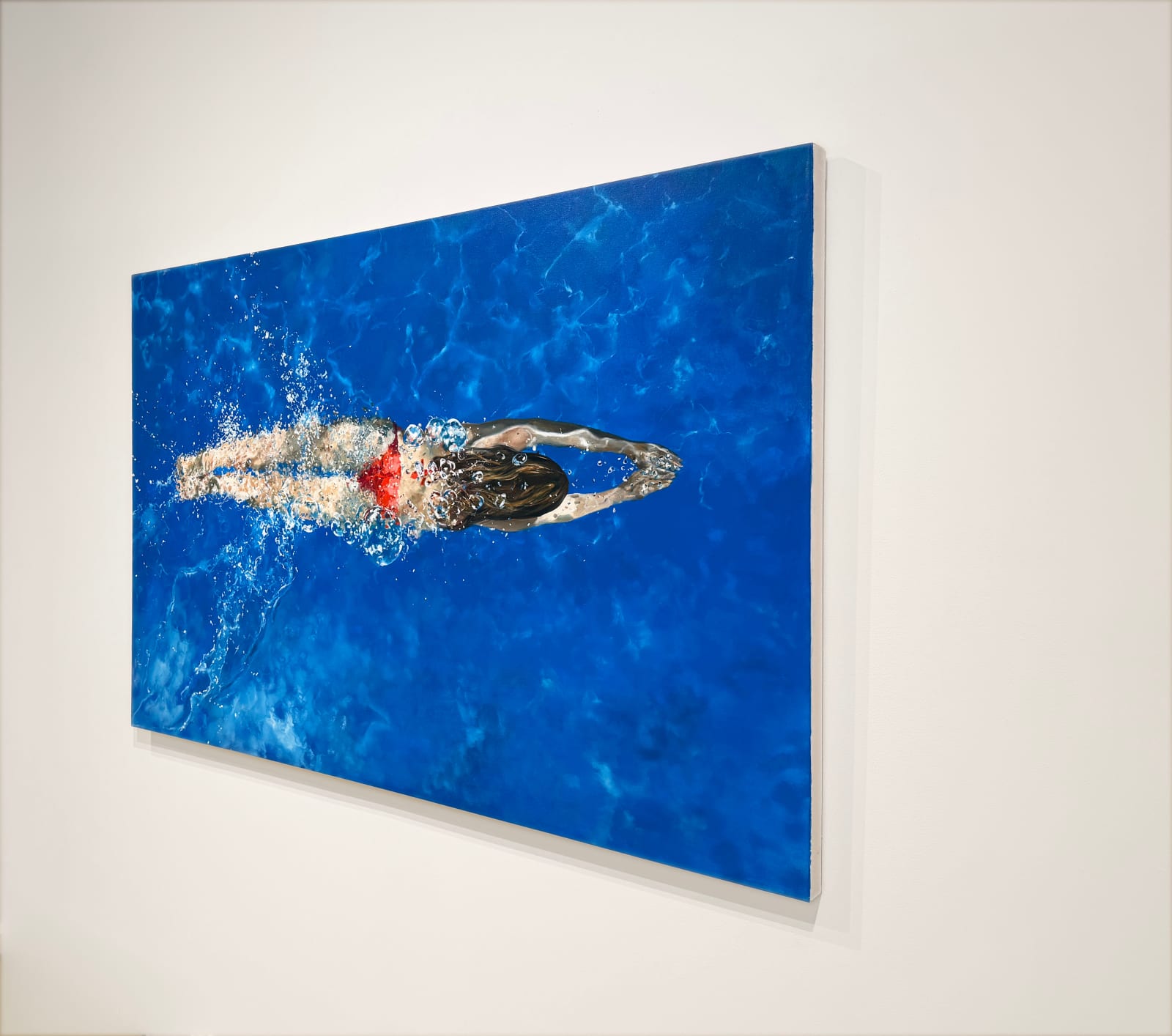 Painting of a woman swimming