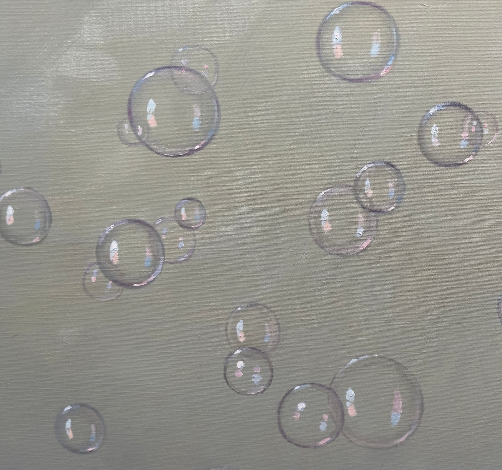 Soda crates stacked on top of each other with apples blowing bubbles atop