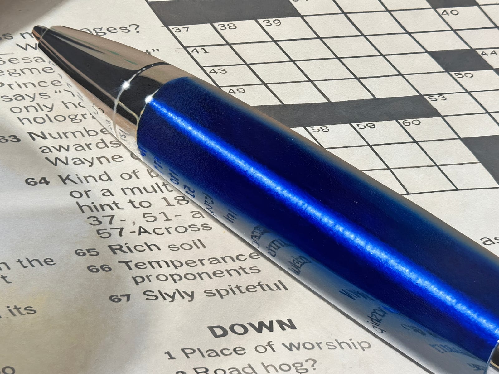 Photorealistic painting of pen, crossword puzzles, and glass of white winePhotorealistic painting of pen, crossword puzzles, and glass of white wine