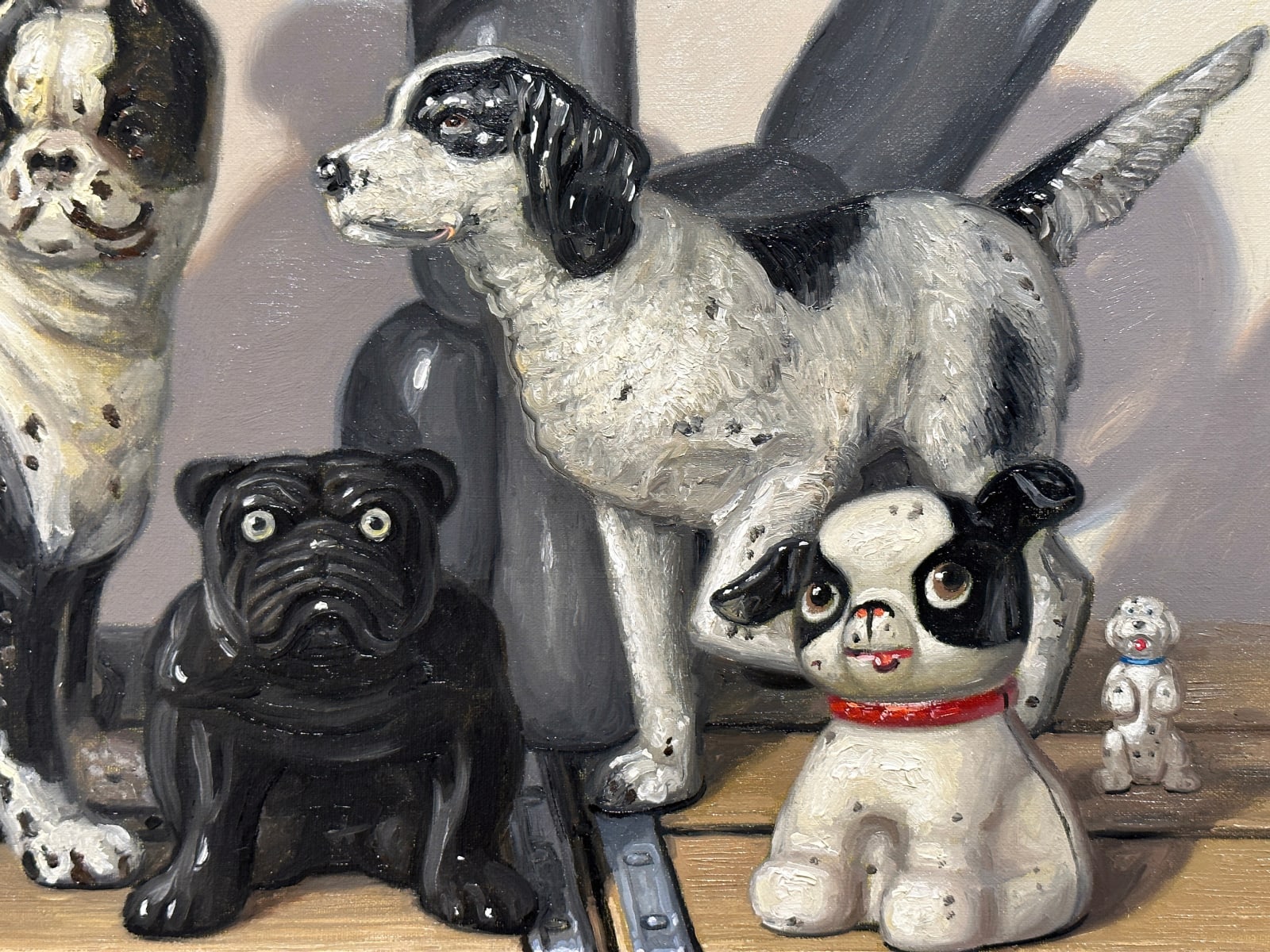 Painting of black and white dog figurines on top of black and white wooden soda crates