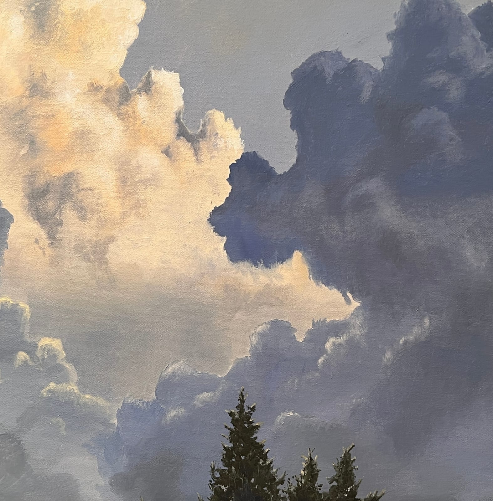 Oil painting of tree with large clouds on canvas