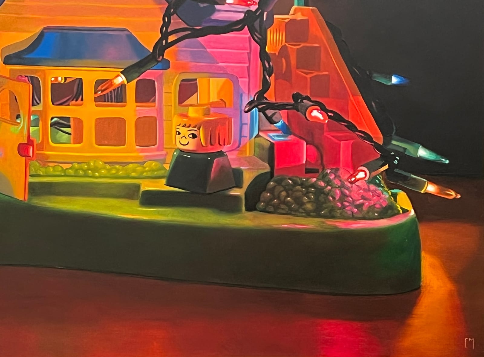 Detail of A Fischer Price Play house is wrapped and filled with a strand of colored lights with different Fischer Price toy characters placed in and around the house