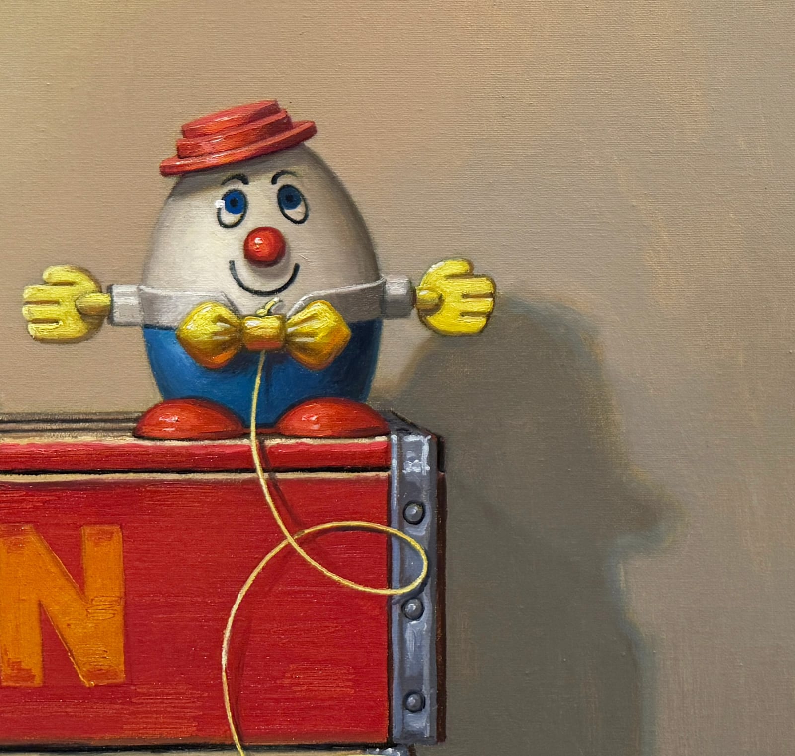 Still life painting of a toy chicken and an egg