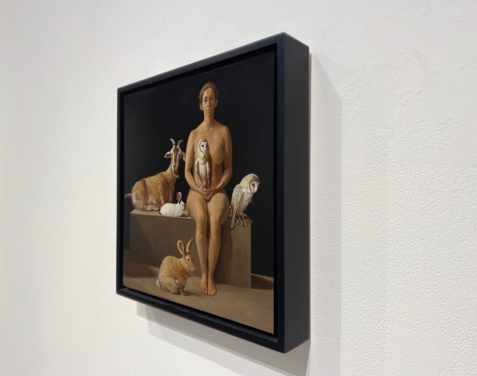 Oil painting of animals and rescuer isolated on panel