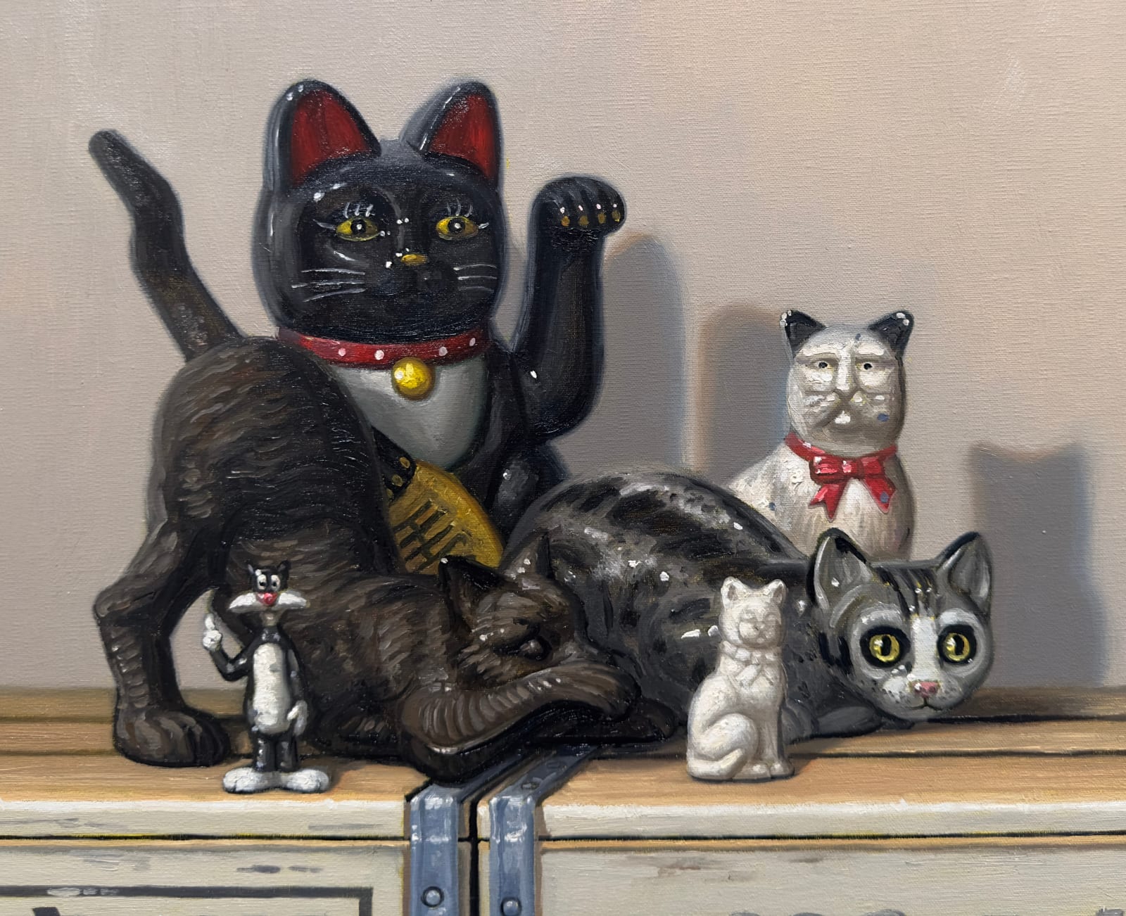 Cat and dog figurines atop stacked soda crates