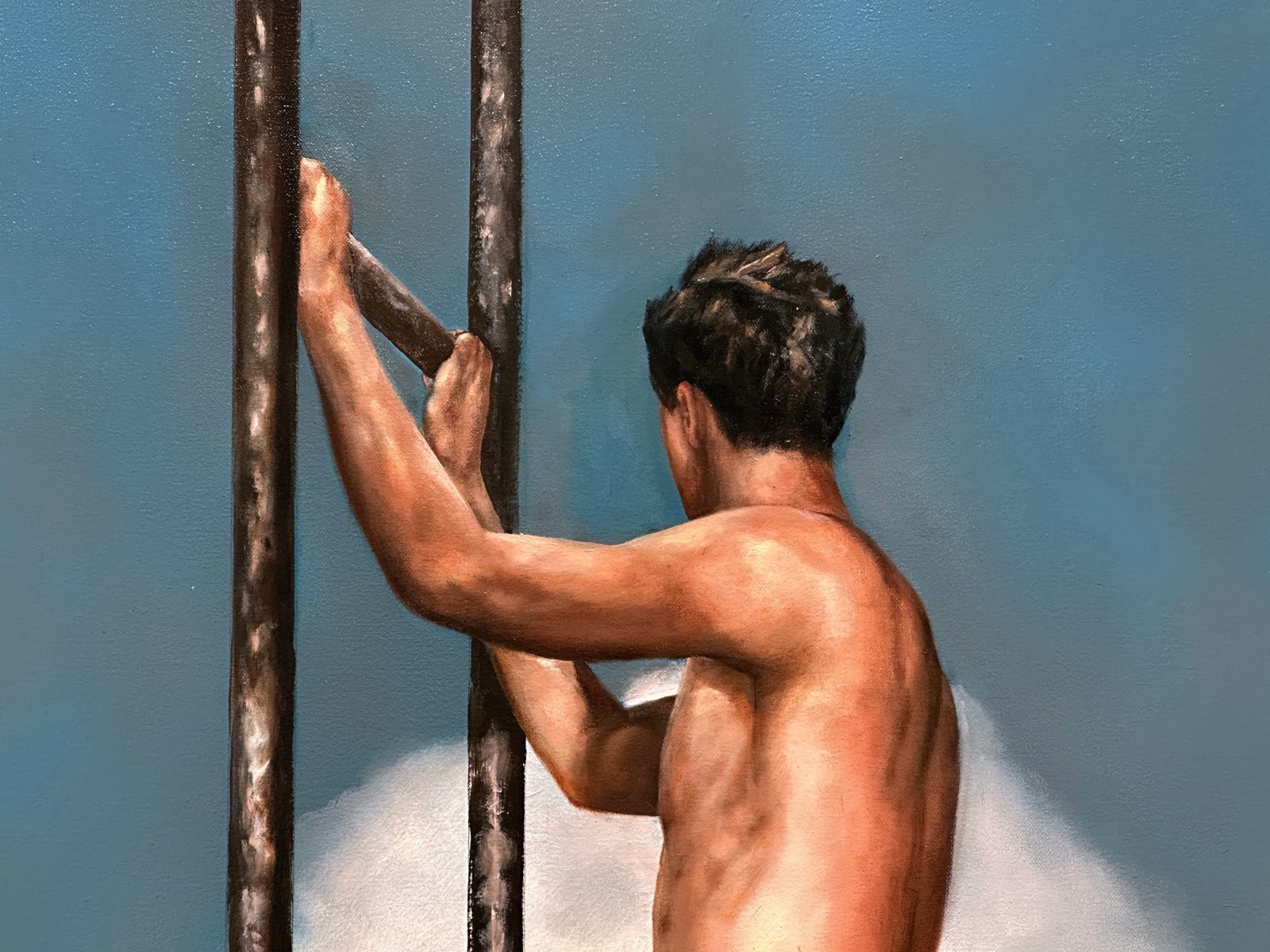 Man in orange bathing suit shorts standing on a small diving board in the sky