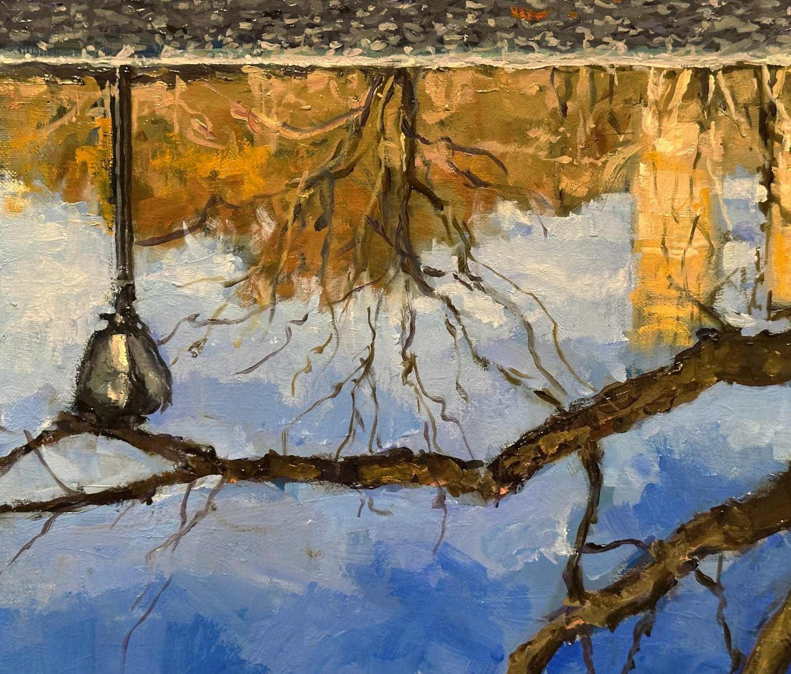 Landscape of a tree in a park reflecting in water