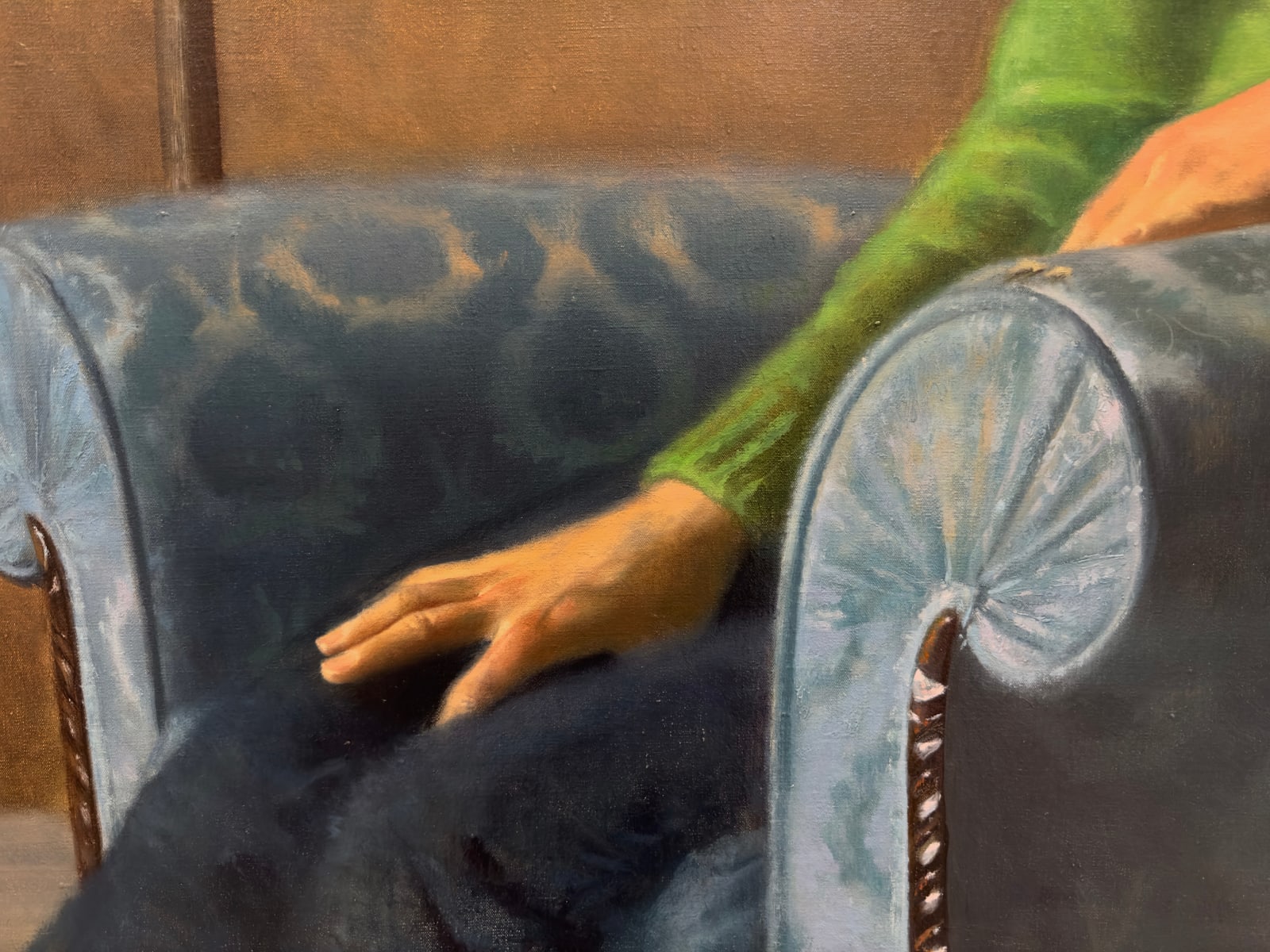 Painting of a woman sitting in an arm chair