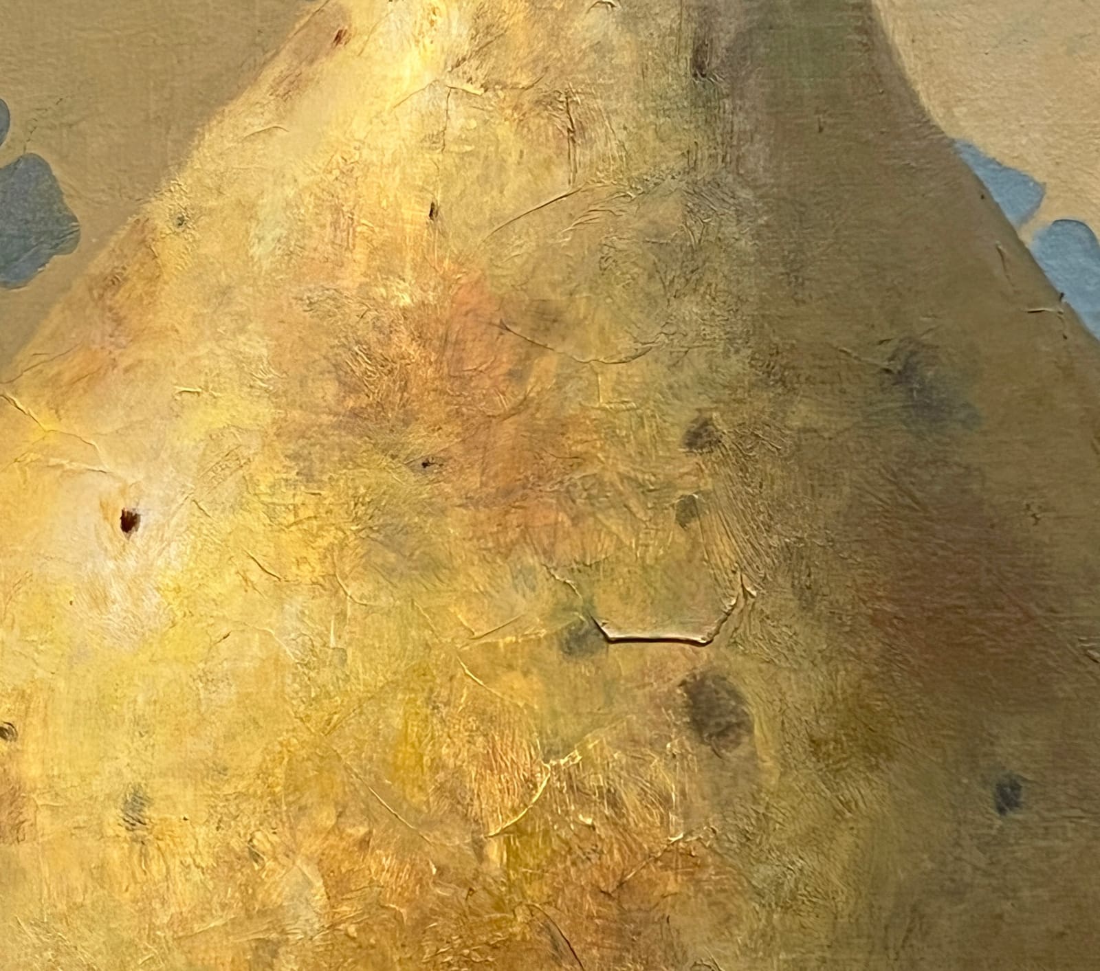 Pear sitting on table with blue design in background