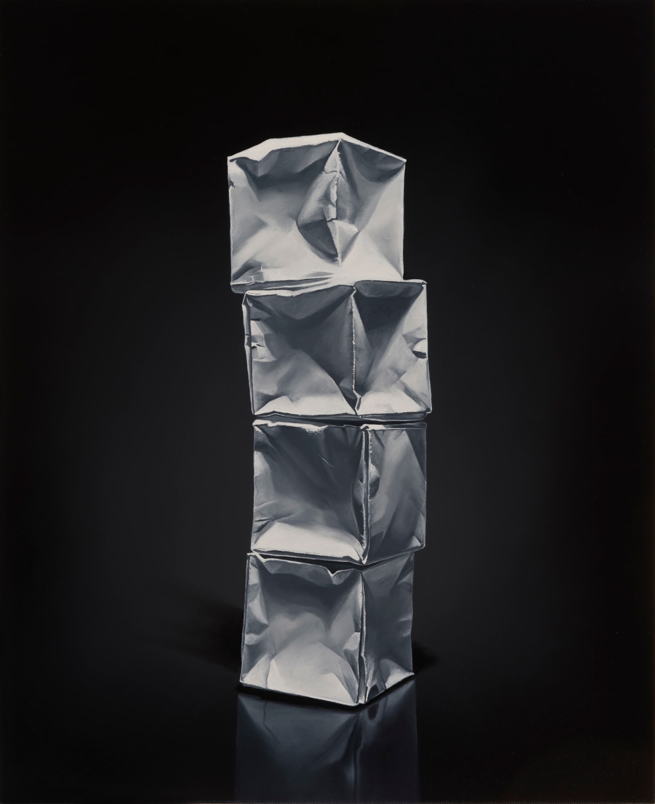 Column of 4 white origami paper boxes stacked and leaning forward