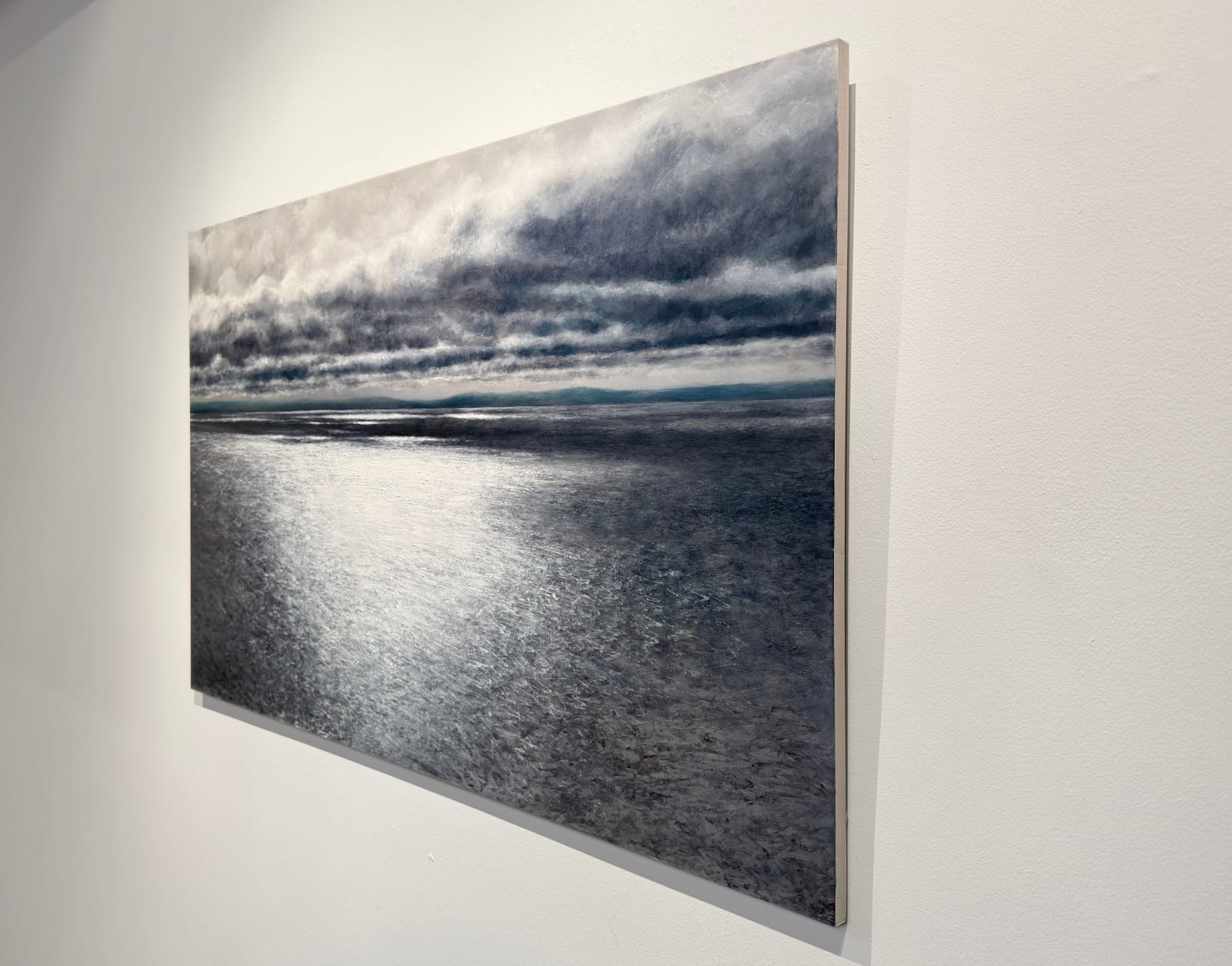 Painting of sun reflecting on an ocean