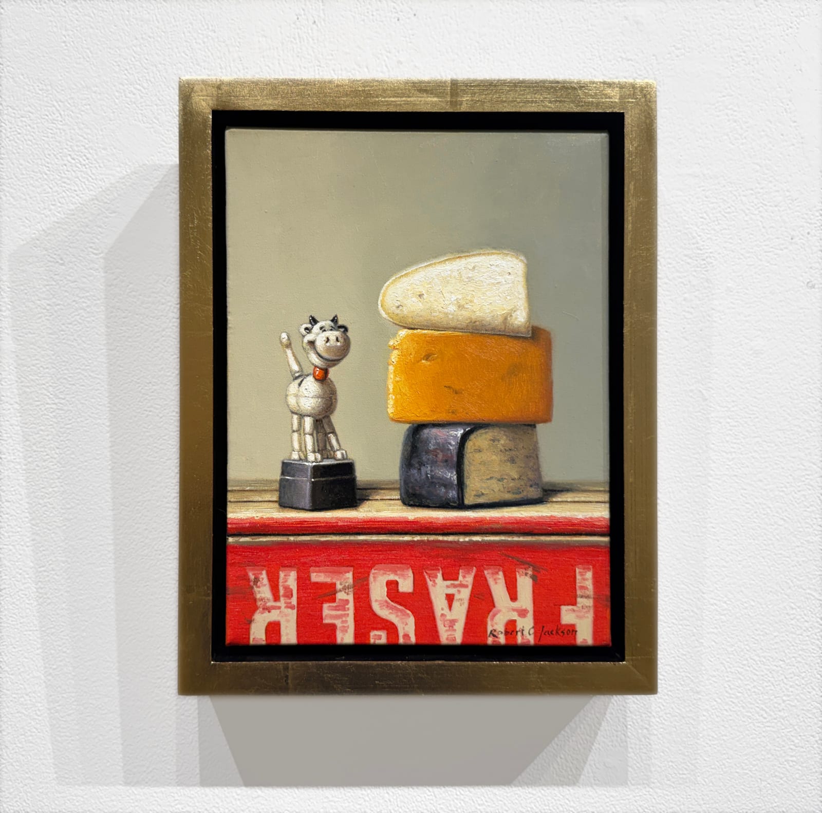 Painting of a toy cow and cheese