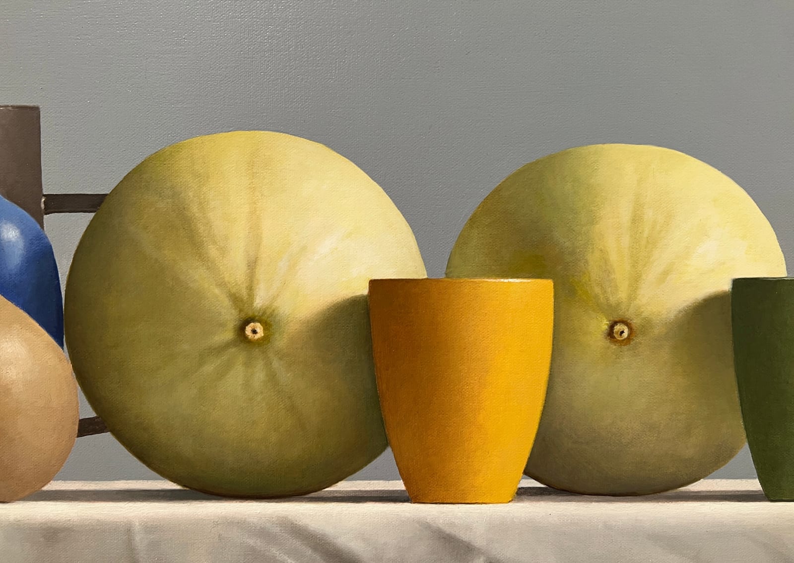 Mugs and pottery before two melons