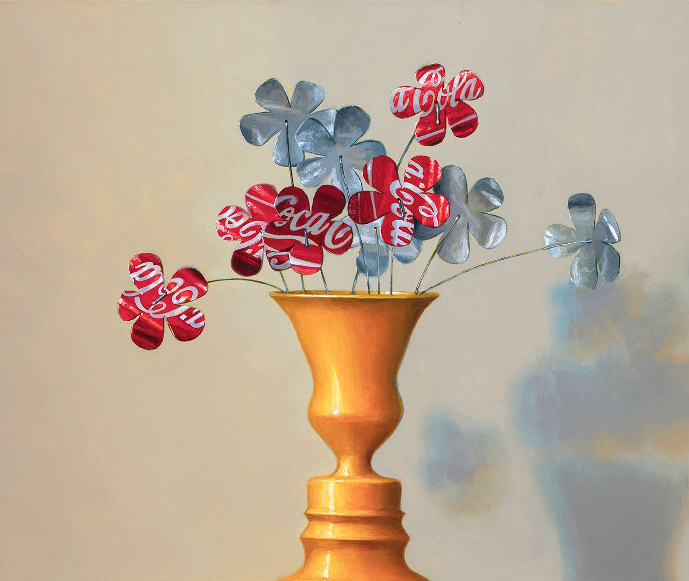 Top detail of Flowers made from Coca Cola cans on top of red and yellow soda boxes with hand and foot prints