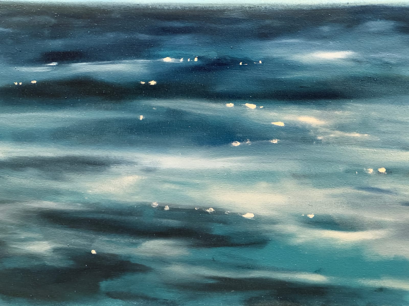 Man in bathing suit doing a cannon ball dive through the air above water