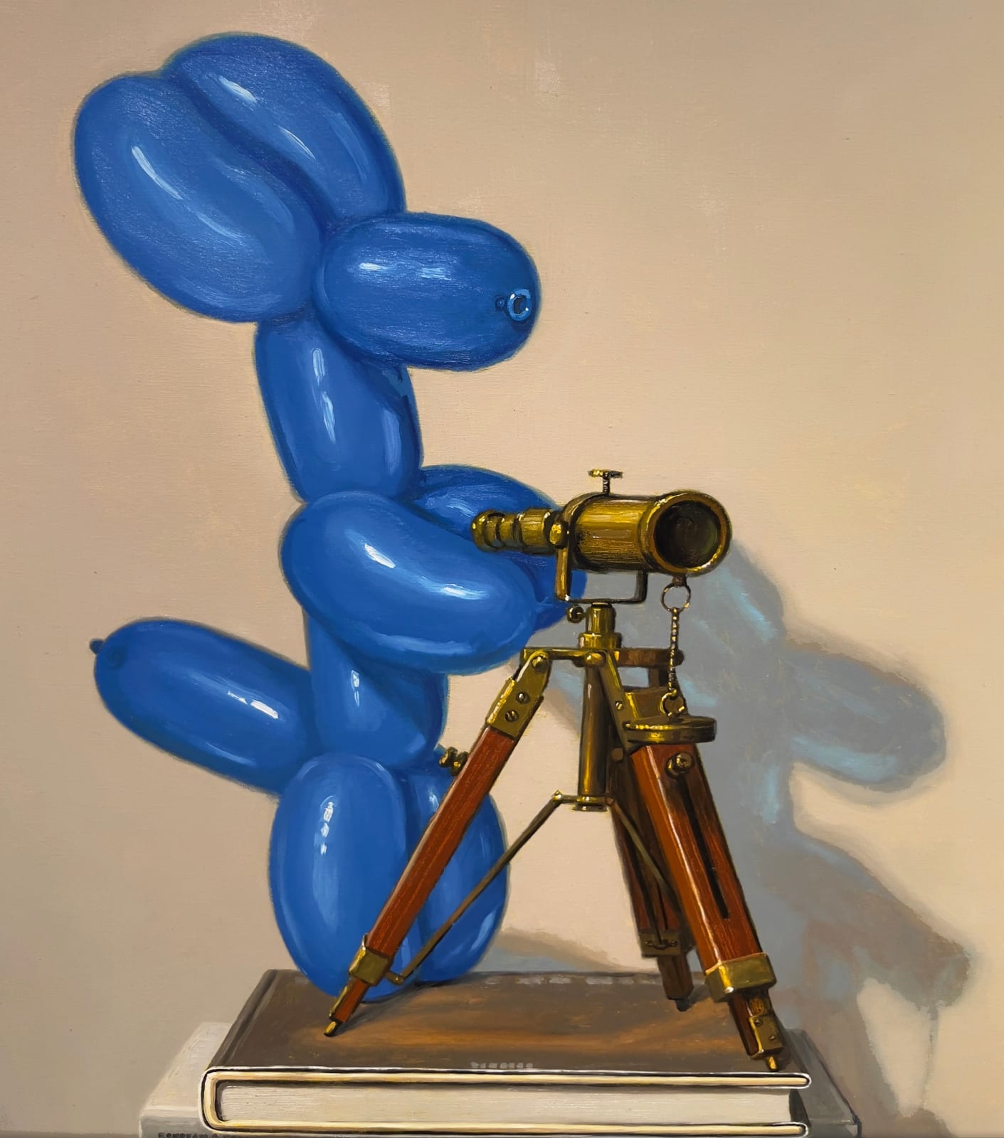Painting of blue balloon dog on top of a stack of art books