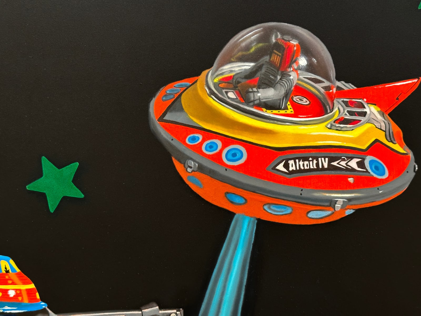 Painting of toy spaceships and VHS tape