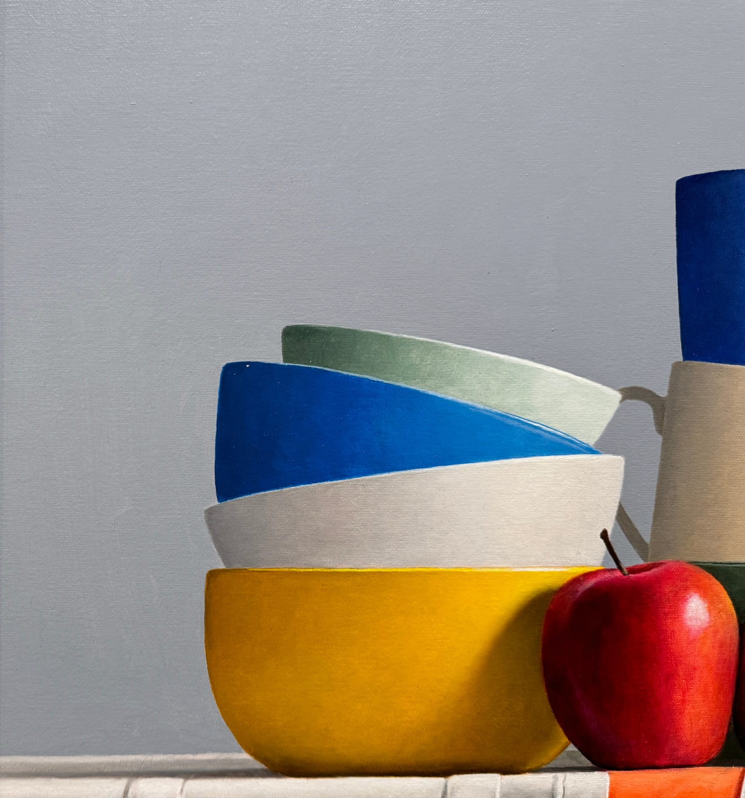 Still life of stacked bowls and two apples