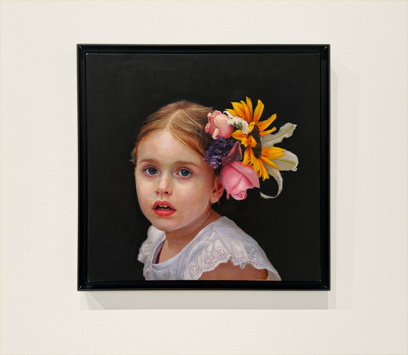 Portrait of a little girl with flowers in her hair