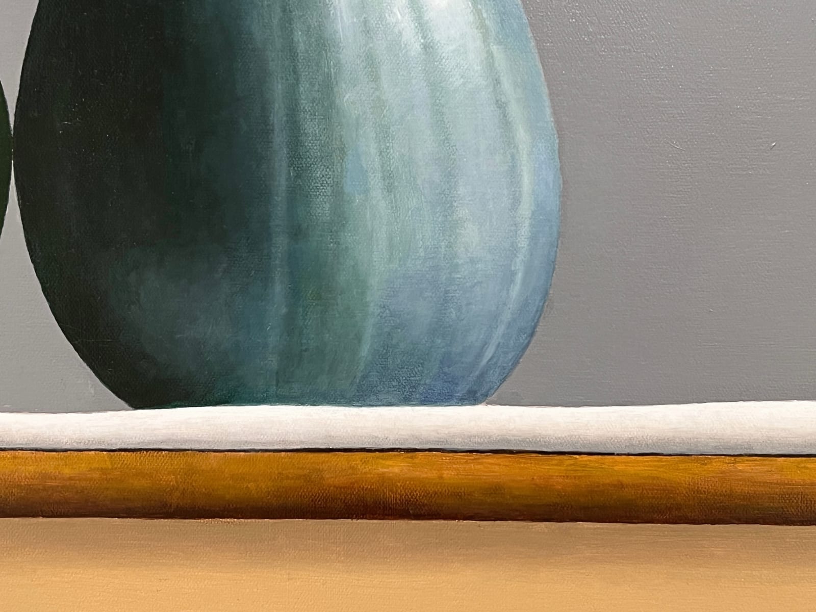 Detail of Watermelon and zucchini sitting on table barely touching